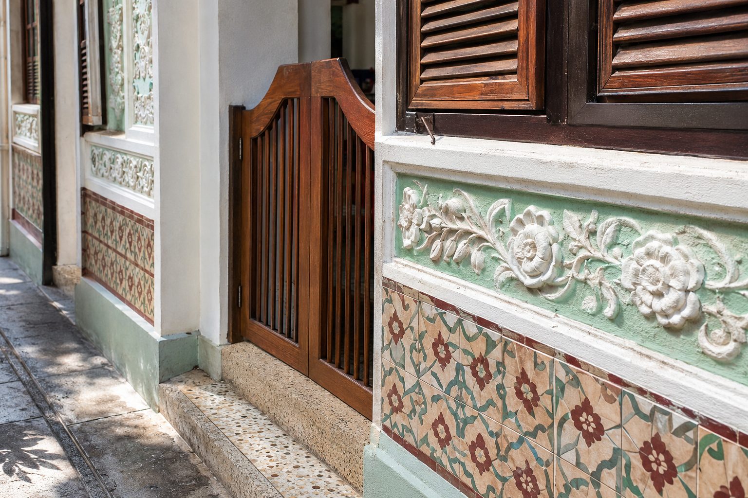 Invented ceramic tiles, plaster flowers, timber shutters and a half-height gate